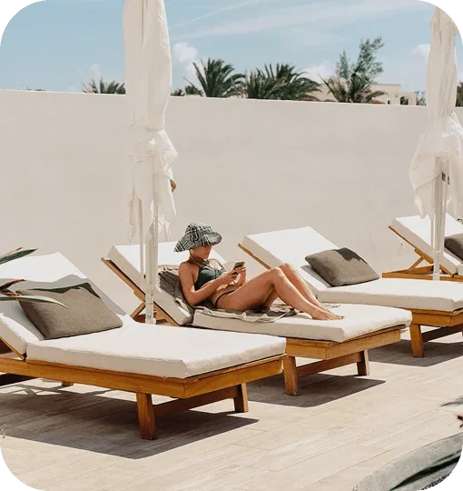 Person laying on sun lounge chair 