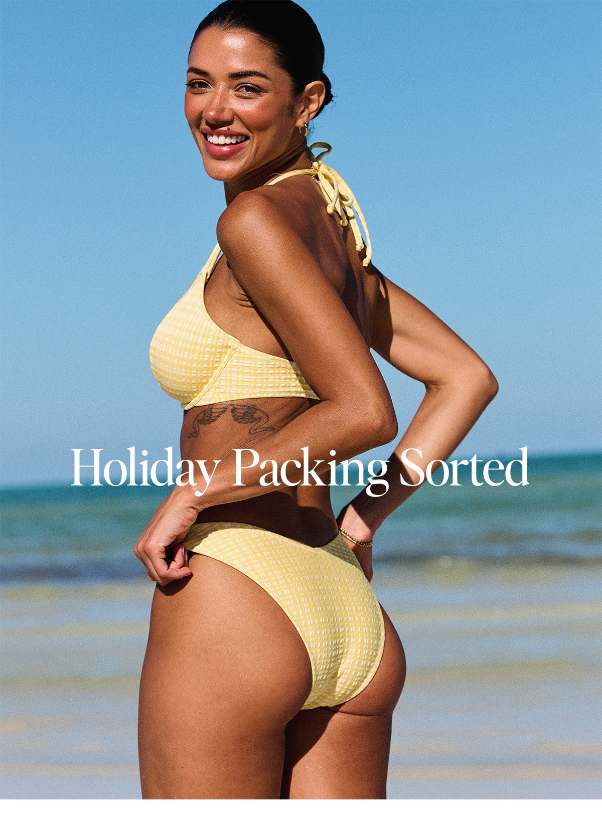 Holiday Packing Sorted. Model wears Jolie Bikini in yellow gingham