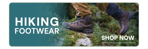 HIKING FOOTWEAR. A close up on a hiker's feet, wearing Scarpa Men's Terra GORE-TEX Walking Boots