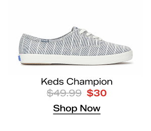 A side view of the Keds Champion Chambray Lurex Stripe Lace-Up in vintage indigo. The style was $49.99 and is now $30. Shop Now.