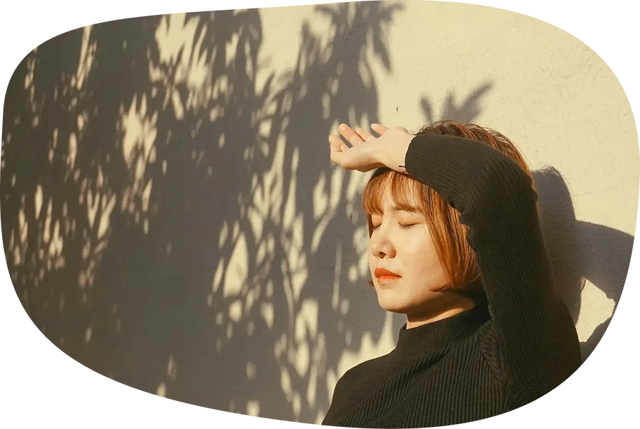 Image: Person with hand above head