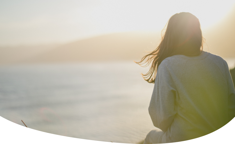 Image: Person looking out, near the ocean