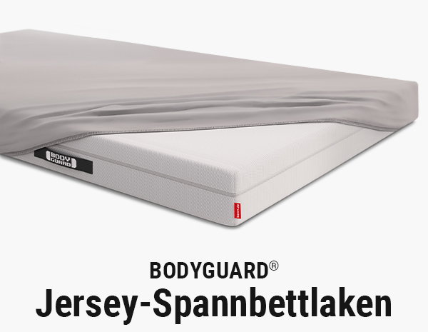 Die BODYGUARD Matratze zur Hälfte bezogen mit dem BODYGUARD Jersey-Spannbettlaken.