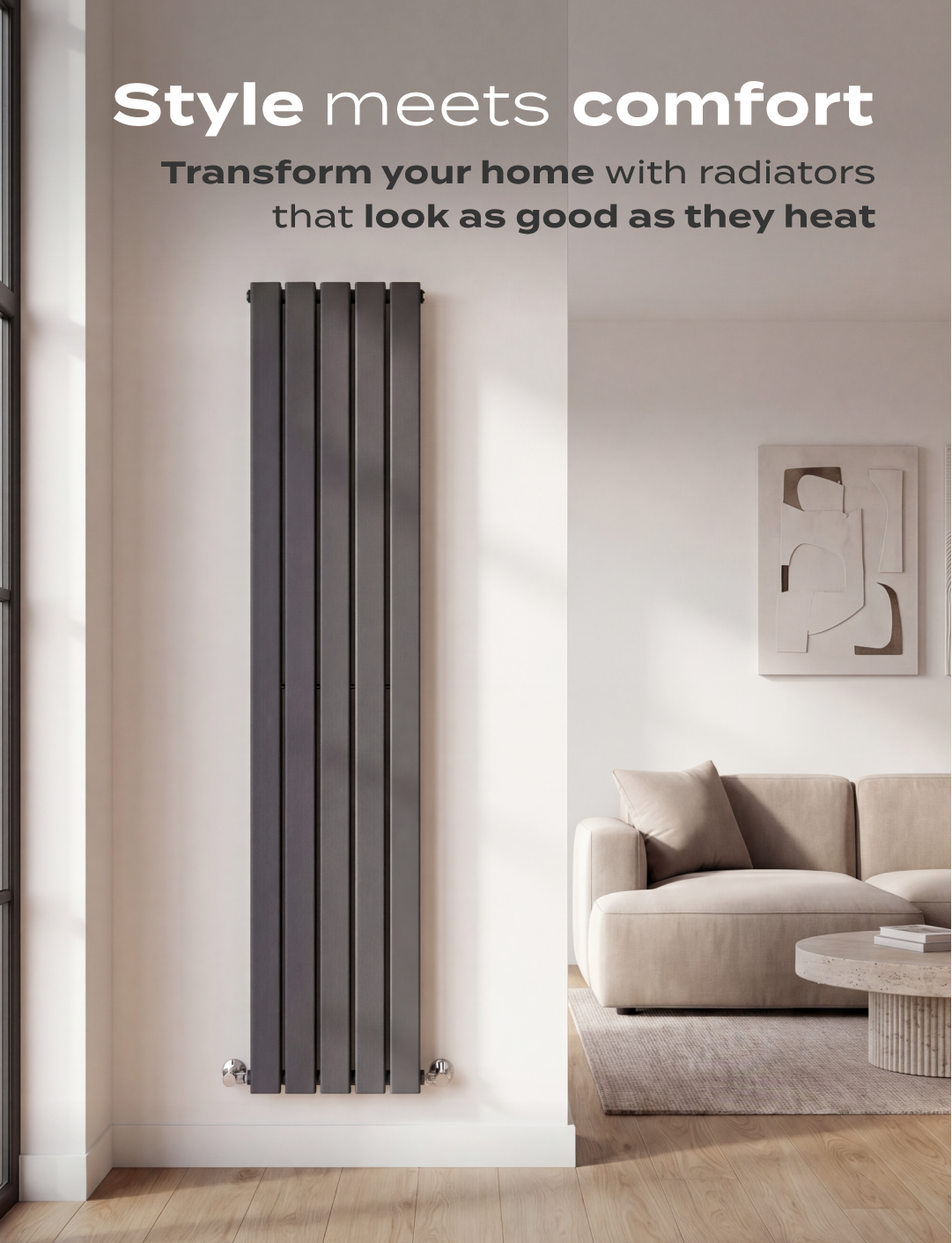 Modern vertical anthracite radiator mounted on a light wall in a minimalist living room with beige sofa and wooden flooring.