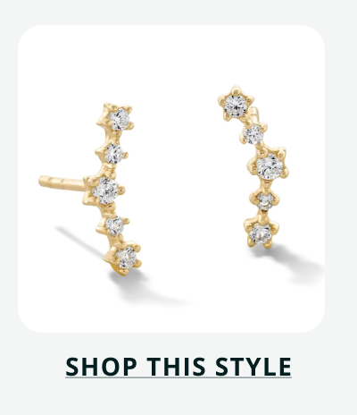 Gold ear climber studs with five round stones of varying sizes in upward curve. Click here to shop this style