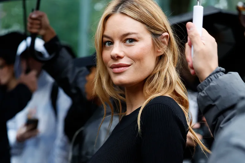 Image may contain: Camille Rowe-Pourcheresse, Face, Head, Person, Adult, Blonde, Hair, Happy, Smile, Clothing, and Coat
