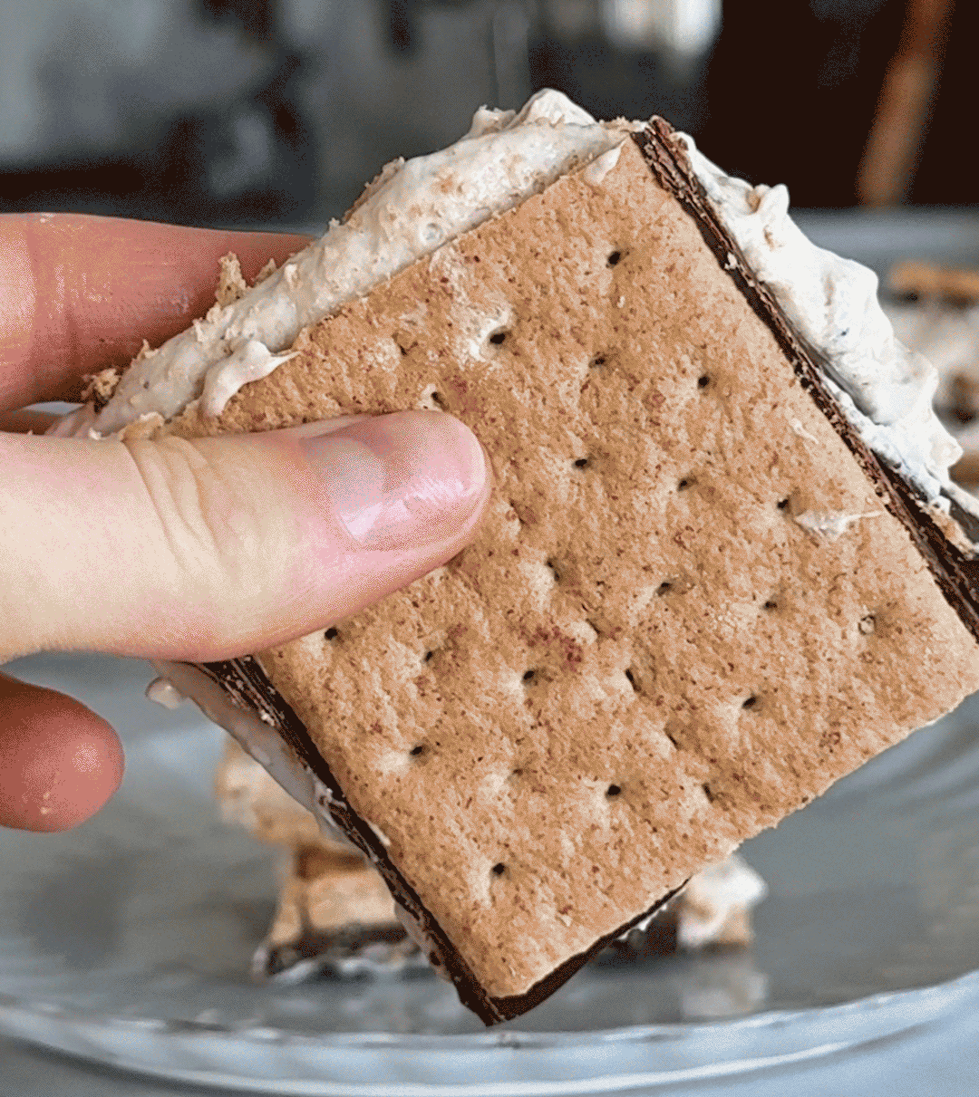 Gif of @oxbowfood preparing a mixture of Cool Whip, Vanilla Ka'Chava, and melted chocolate to make frozen s'mores