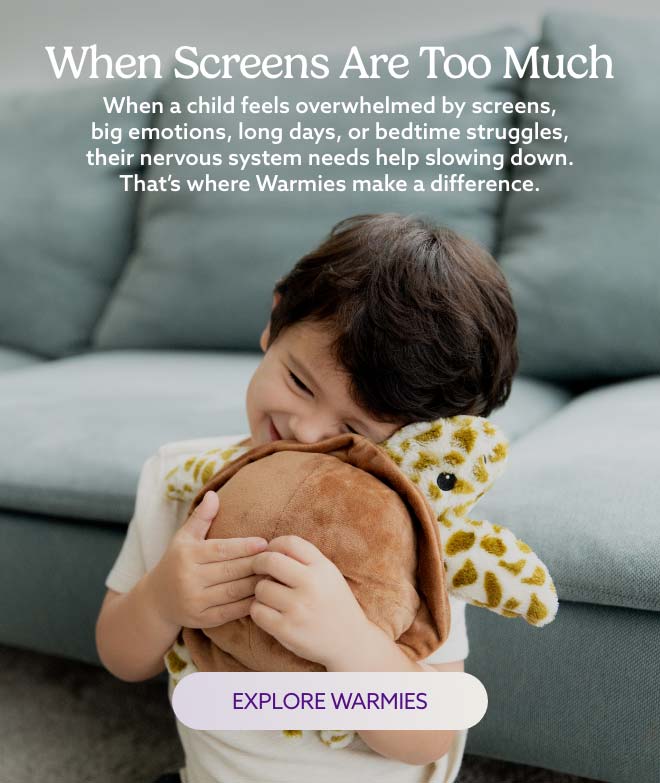 A little boy hugging Turtle Warmies. Explore Warmies.