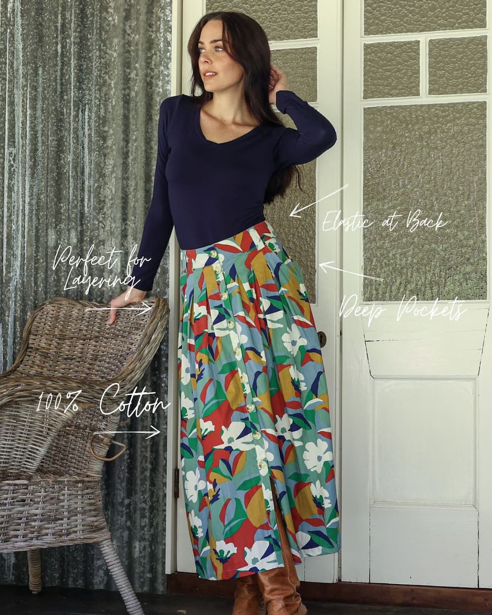 model wearing blue top and multicoloured cotton skirt 