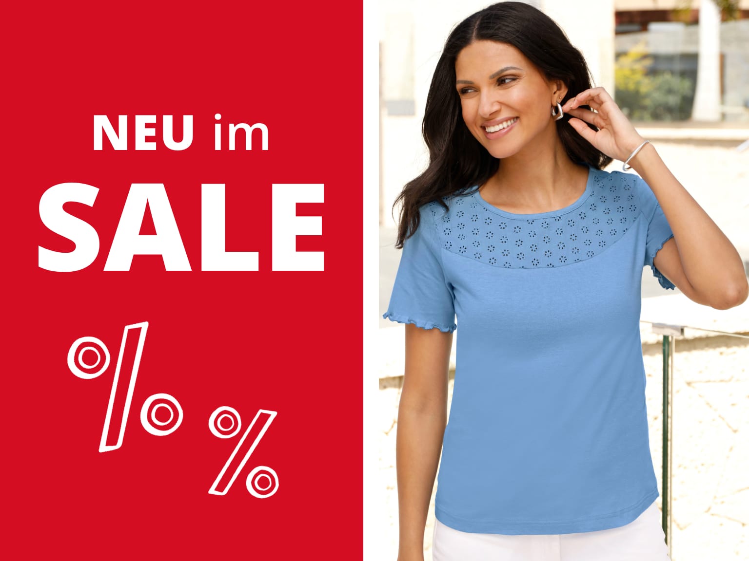 Ein Model trägt ein hellblaues T-Shirt mit kurzen Ärmeln und einem Muster aus kleinen Blumen am oberen Teil. Neue Artikel im Sale. Bild oder Schaltfläche darunter anklicken, um in den Shop zu gelangen >
