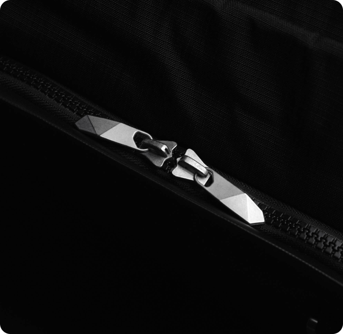 Image of a pair of silver zippers with functional design.