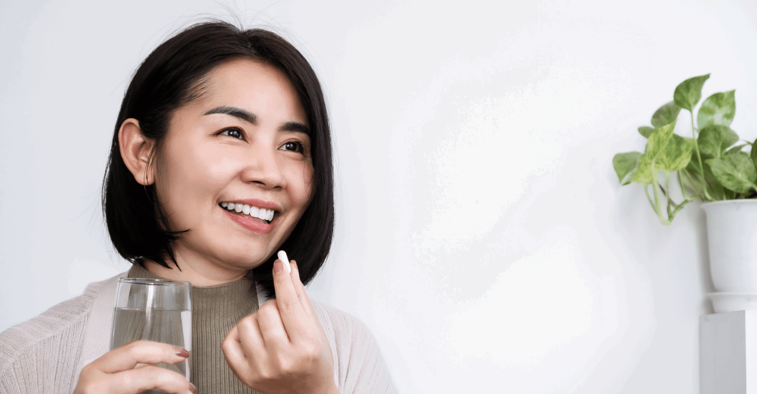 woman taking supplement
