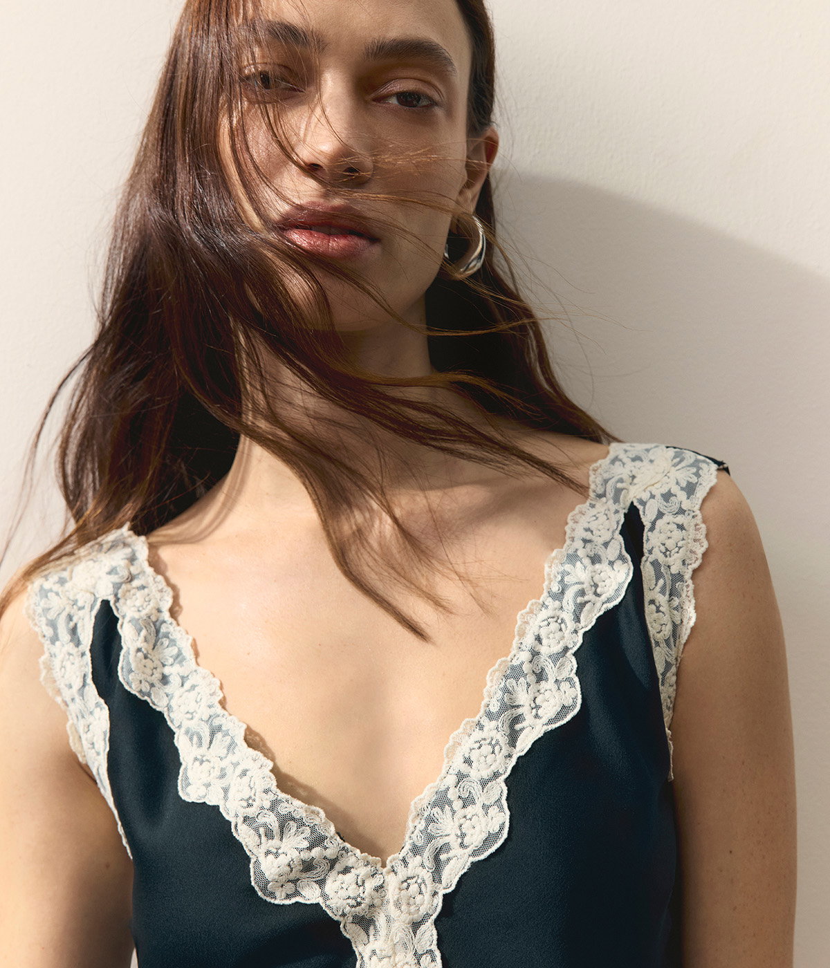 Woman wearing a Black Mix Satin V-Neck Lace Insert Midi Slip Dress