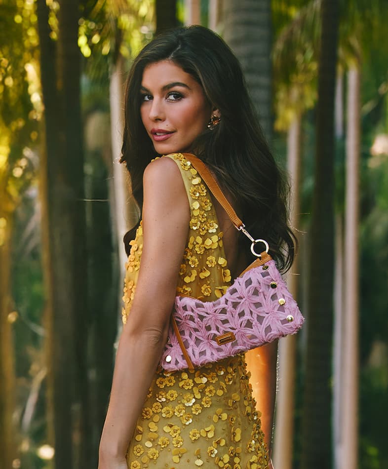 Animated gif of model with new summer bags. 