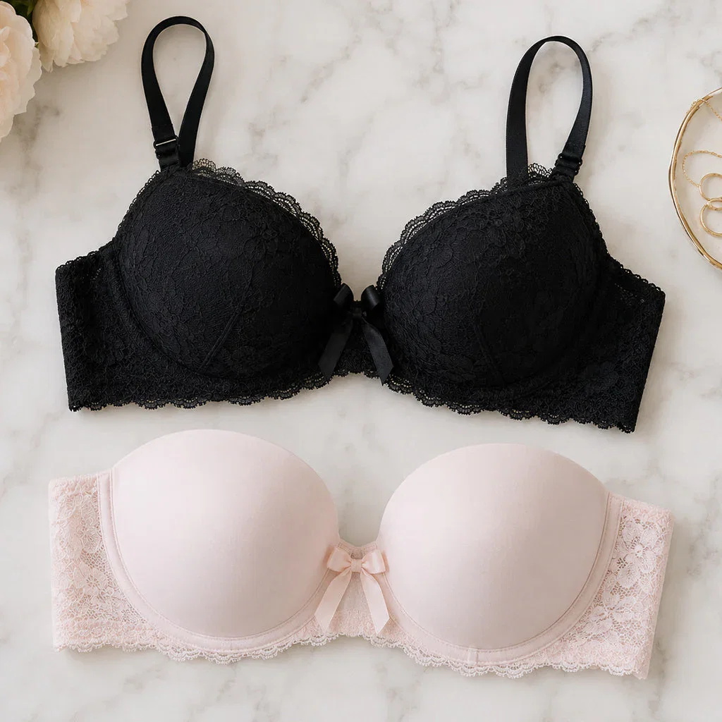 Delimira bra collection featuring black lace and blush pink lace underwire bras displayed on marble background
