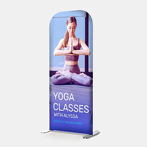 A freestanding tension fabric display promoting a yoga class.