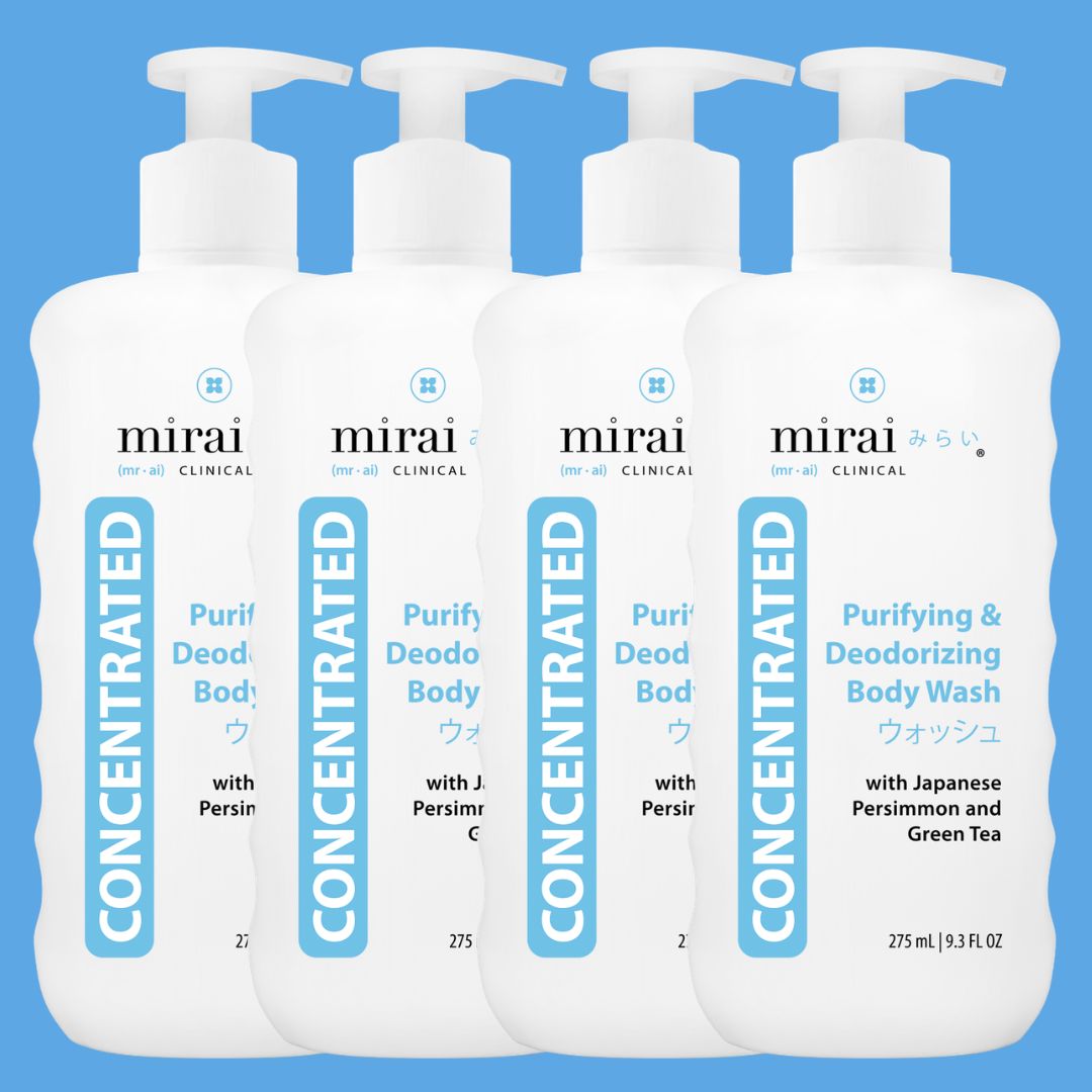 Four white pump bottles of Mirai Clinical Concentrated Purifying & Deodorizing Body Wash, with Japanese Persimmon and Green Tea. The bottles are arranged in a row against a light blue background. (square)