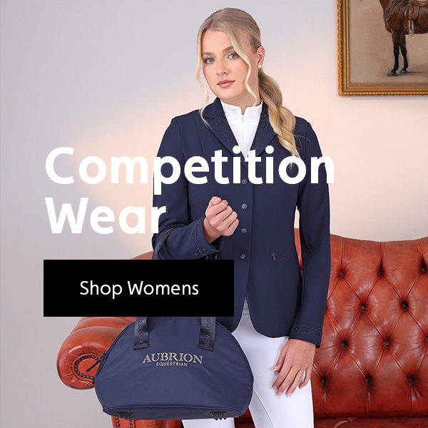 Woman wearing competition wear, holding a Aubrion hat bag