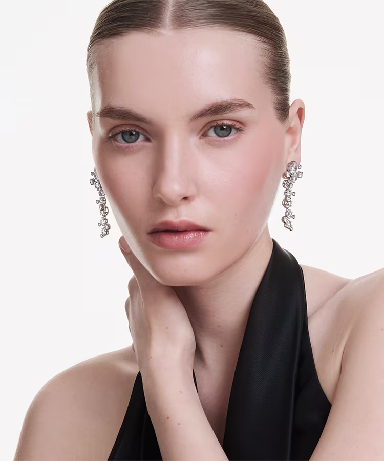Model wearing Swarovski Constella drop earrings