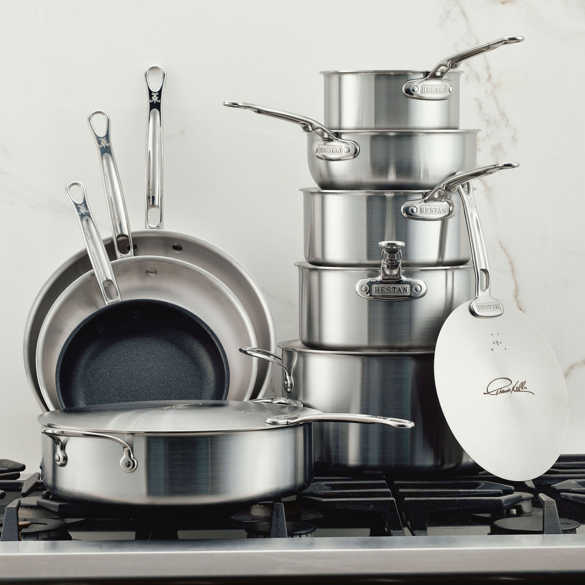 IMG: Stainless Steel 11-Piece Cookware Set on marble countertop