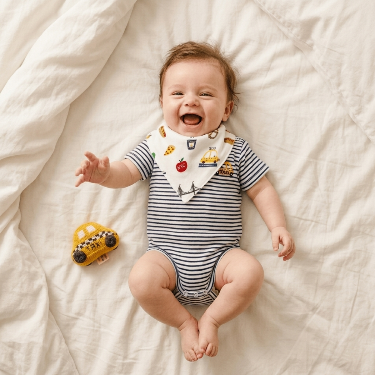 Baby wearing the NYC Taxi Bodysuit Rattle & Bib Set