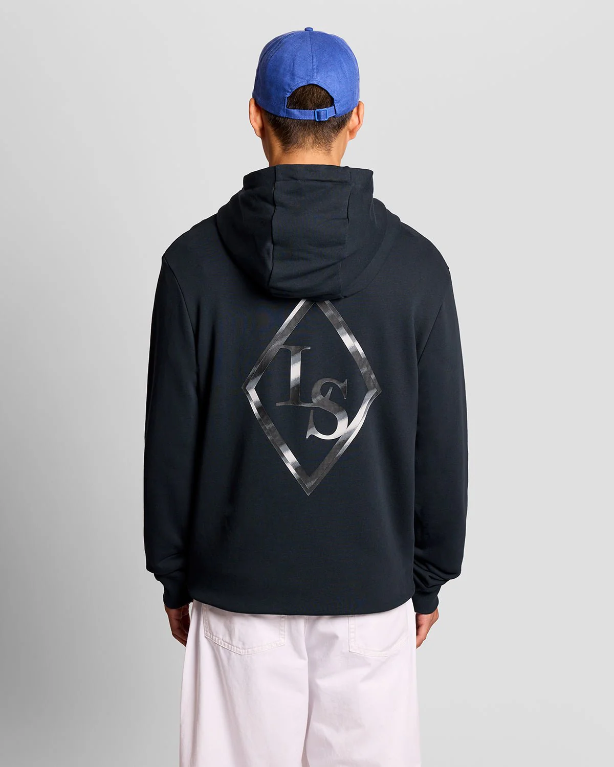 Model wearing a graphic print hoodie