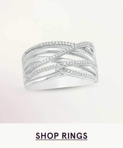 Wide, silver band featuring criss-cross design with rows  of pavé-set diamonds. Click here to shop rings