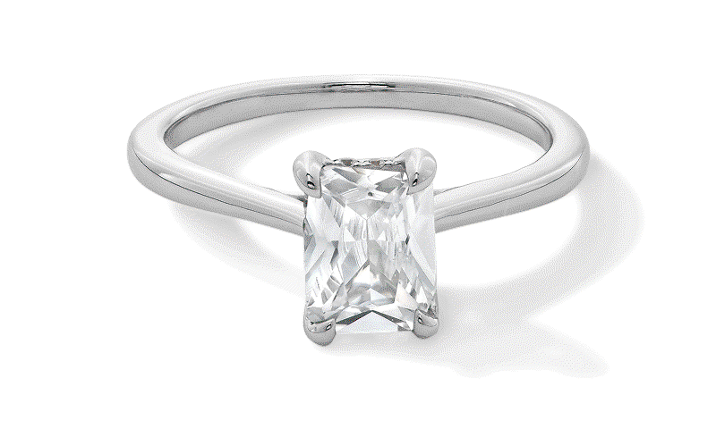 Rotating GIF featuring three styles of solitaire diamond engagement rings in white and yellow gold.