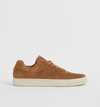 Pin punched suede sneaker
