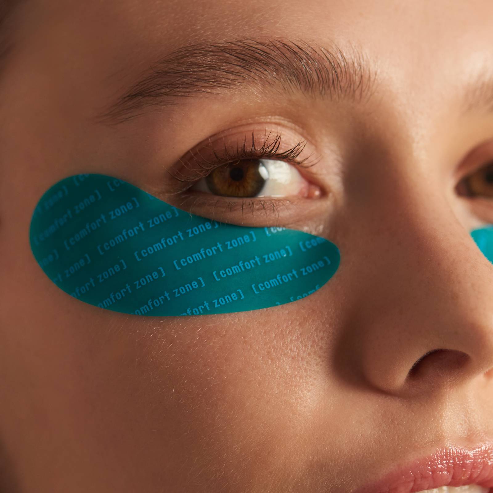 Woman wearing blue eye patches