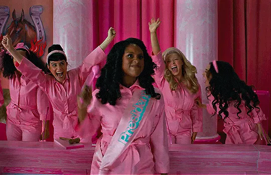 Issa Rae in the Barbie movie pumping her fist.