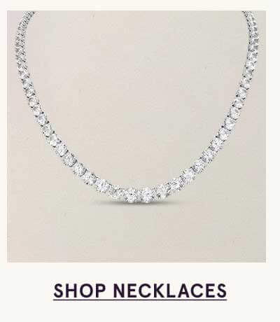 Round-cut diamond tennis necklace. Click here to shop necklaces