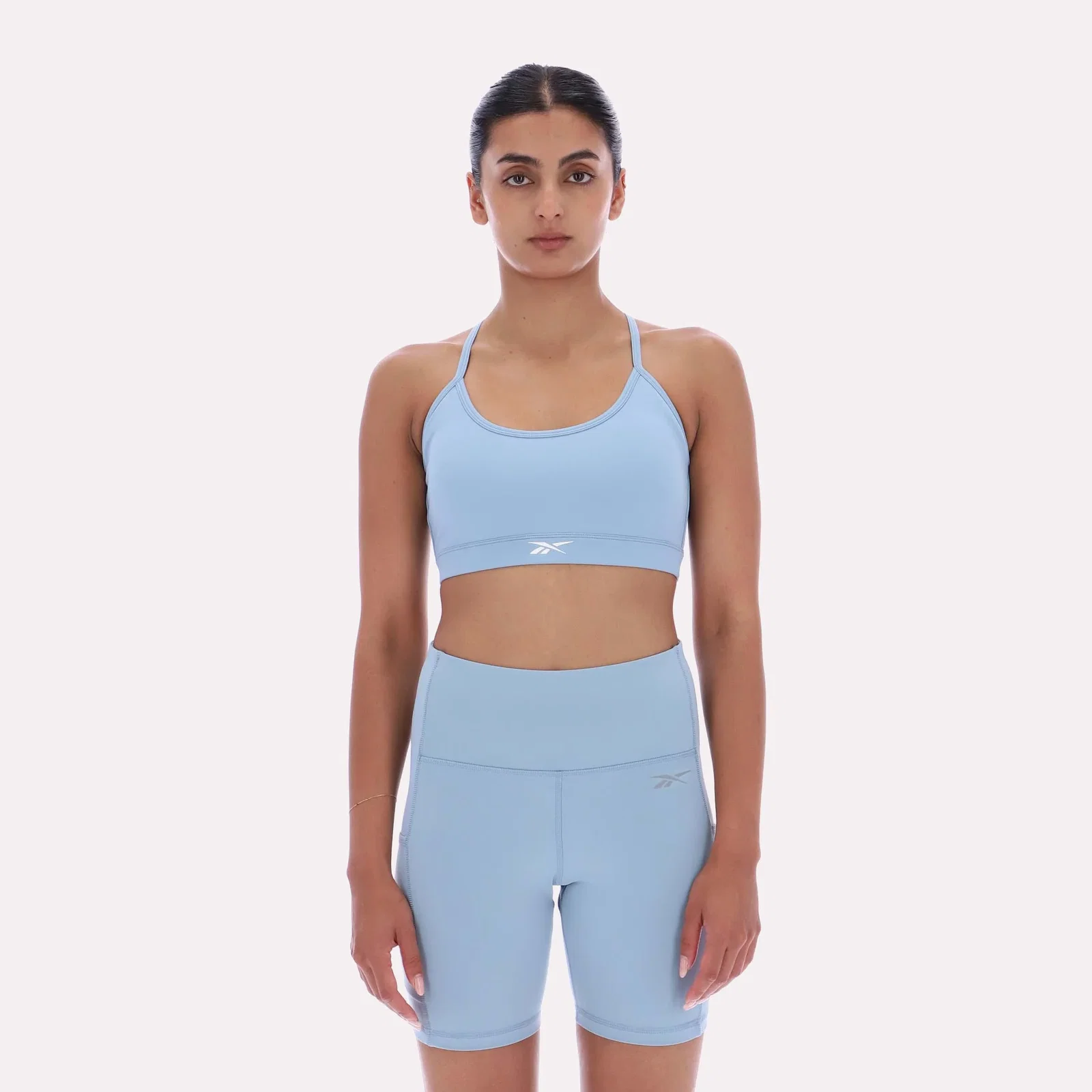 Image of Reebok Apparel Women Core Strappy Bra - Medium Support LEISURE BLUE