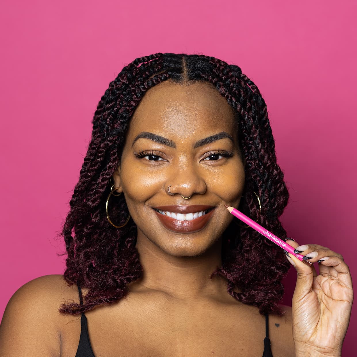 woman holding horizon lip pencil