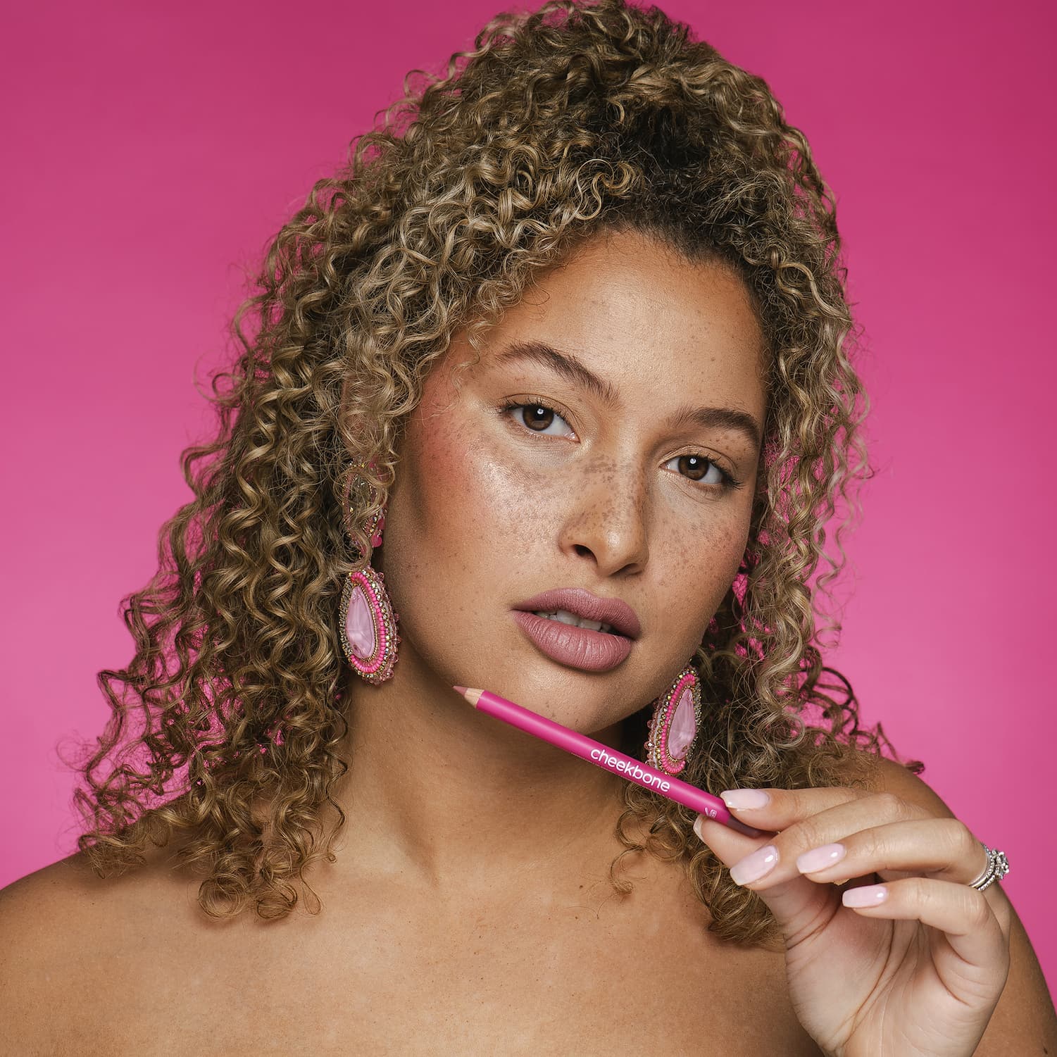 woman holding Horizon Lip Pencil