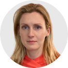 Transport correspondent Katy Austin, who has shoulder-length blonde hair and wears a red top.