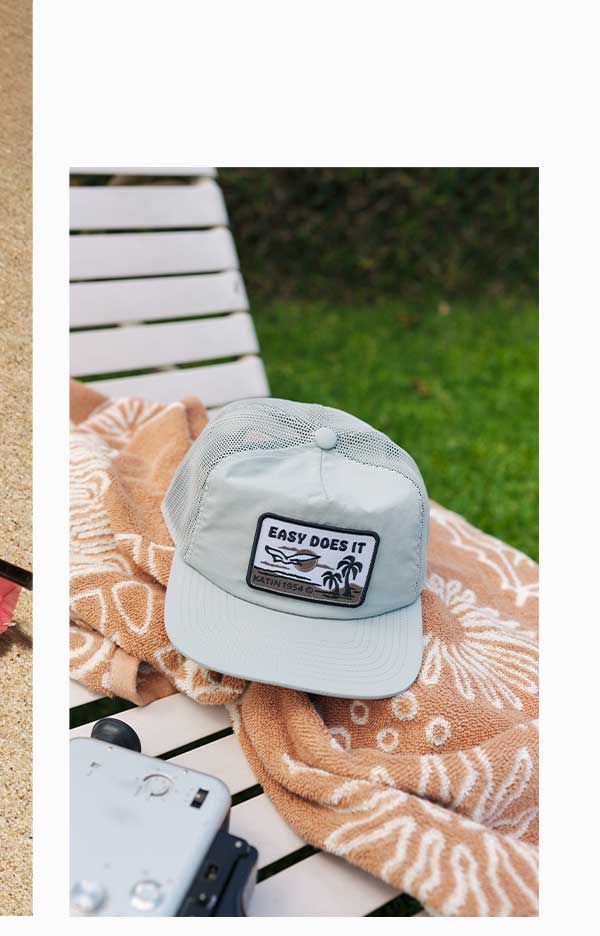 Sqwuak Hat on towel and beach lounger