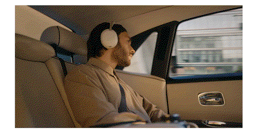 Animated GIF of a man in a luxury car listening to music with The 1000X Collection headphones.