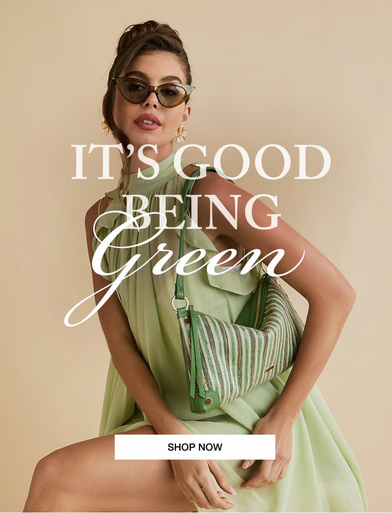 It's Good Being Green. CTA: Shop Now. Model in green dress with Kyle Sml in Pickle stripegold