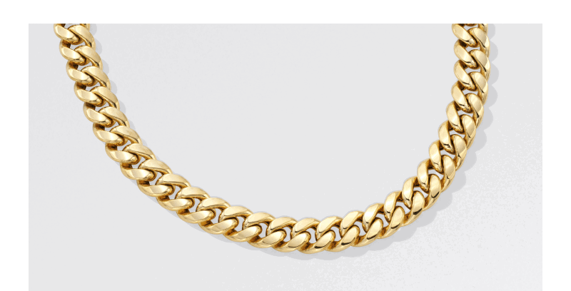Thick gold curb chain necklace with interlocking links.