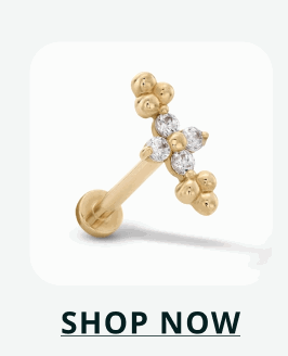 Gold flat-back stud designed as a small, ornate cross accented with multiple stones. Click here to shop now