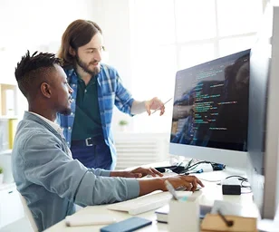 image-two-people-reviewing-code-on-screen