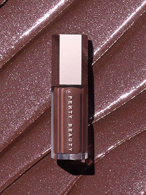 RIHANN'S NEW FAVE GLOSS BOMB SHADE Lock lips with 'Rose Amber,' a shimmering cool taupe brown shade that looks good on everyone. GLOSS BOMB