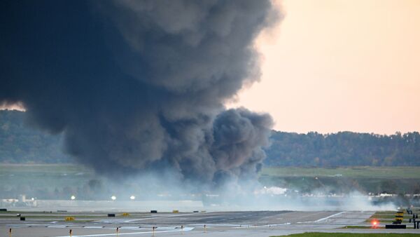 Large cloud of black smoke rises to the sky after the UPS Flight 2976 crash.