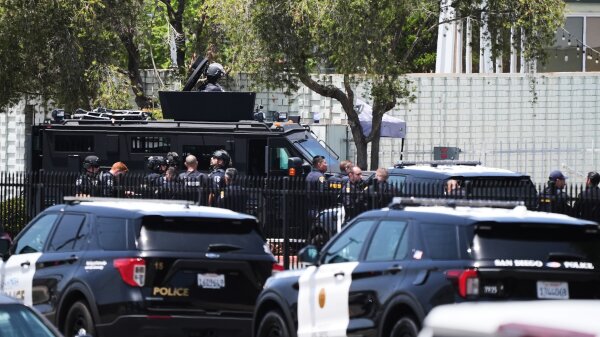 The rearview of multiple police vehicles outside of the Islamic Center of San Diego. 