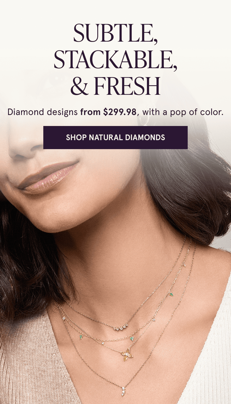 A model wearing gold gemstone necklaces. Subtle, stackable and fresh designs from $299.98. Click to shop natural diamonds