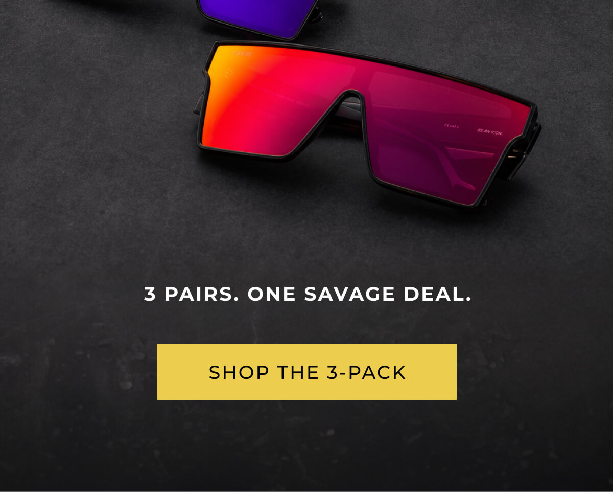 Sleek sunglasses with red-orange mirrored lenses on a dark surface. Bold text reads "3 pairs. One savage promotion." Button says "Shop the 3-pack."