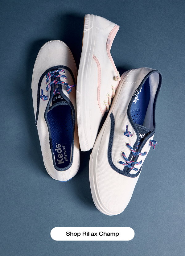 A blue background and a pair of the Rillax Champ Washed Twill Pop Binding Slip-Ons in snow white/navy facing opposite directions and the Rillax Champ Washed Twill Pop Binding Slip-On in snow white/pink in the middle. Shop Rillax Champ.