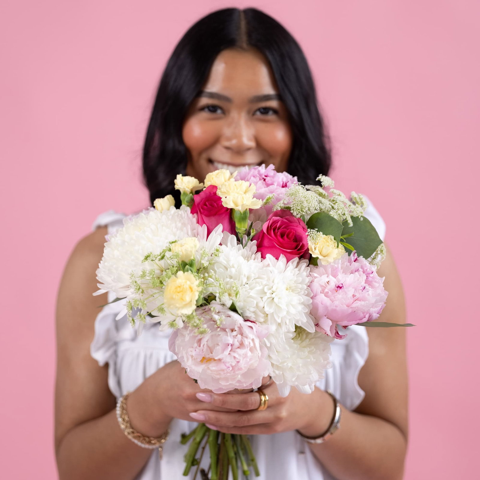 Woman holding Callia's The Peony bouquet