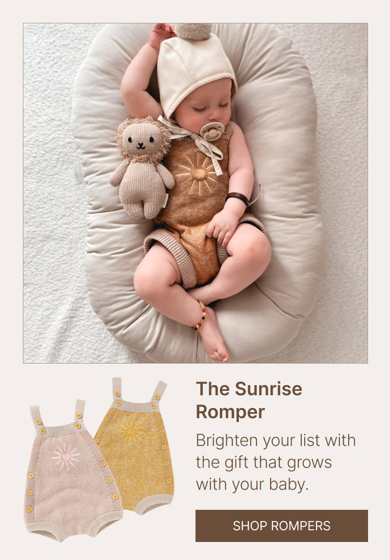 Baby resting with a plush toy beside baby carrier product images in soft patterned fabric and neutral colors.